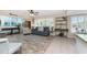 Spacious living room with new plank flooring, neutral paint colors, and bright, natural light at 5055 N Beach Rd # 208, Englewood, FL 34223