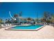 Relaxing pool area with lounge chairs and tables, perfect for relaxing on the Gulf Coast at 5055 N Beach Rd # 208, Englewood, FL 34223