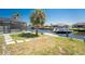 Waterfront backyard with a dock, lift and lush grass provides endless opportunities for relaxation and recreation at 5232 Conner Ter, Port Charlotte, FL 33981