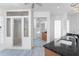 A stylish bathroom with walk-in shower, granite counters, and mirrored closet at 5232 Conner Ter, Port Charlotte, FL 33981