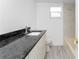 Bathroom features granite counters, white cabinets, and shower/tub at 5232 Conner Ter, Port Charlotte, FL 33981