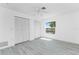 Bright bedroom features large window, ceiling fan, and closet at 5232 Conner Ter, Port Charlotte, FL 33981