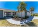 Close-up shot of the front entrance featuring a stylish double door and lush landscaping at 5232 Conner Ter, Port Charlotte, FL 33981