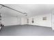 Spacious garage with newly painted walls and floors provides ample storage and parking space at 5232 Conner Ter, Port Charlotte, FL 33981