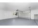 Clean and spacious garage with garage door and interior door at 5232 Conner Ter, Port Charlotte, FL 33981