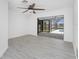An open living room leads to a screened-in lanai and pool at 5232 Conner Ter, Port Charlotte, FL 33981
