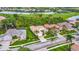 Beautiful aerial view of homes and landscaping, with a lake and golf course in the background of this community at 5433 White Ibis Dr, North Port, FL 34287