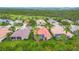 Aerial view of a golf course community featuring mature trees, and manicured lawns at 5433 White Ibis Dr, North Port, FL 34287