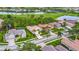Aerial view showcases the community's well-manicured landscaping and golf course views at 5433 White Ibis Dr, North Port, FL 34287
