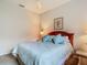 This charming bedroom features a comfortable bed and soft lighting to create a relaxing atmosphere at 5433 White Ibis Dr, North Port, FL 34287