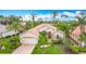 Charming single-story home with a tile roof, paver driveway, and beautifully landscaped front yard at 5433 White Ibis Dr, North Port, FL 34287
