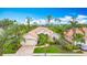 Charming one-story home featuring a paver driveway, lush landscaping, and a two-car garage at 5433 White Ibis Dr, North Port, FL 34287