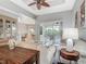 Comfortable living room with hardwood floors, neutral walls, and a view of the screened lanai at 5433 White Ibis Dr, North Port, FL 34287