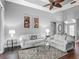 Inviting living room with hardwood floors, ceiling fan, and neutral paint; perfect for relaxation at 5433 White Ibis Dr, North Port, FL 34287