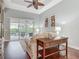 Calm primary bedroom features hardwood floors and sliding doors to outdoor pool and patio at 5433 White Ibis Dr, North Port, FL 34287