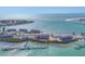 Gorgeous aerial view of beachfront condos with docks, beach, and sparkling ocean views at 6030 Boca Grande Cswy # B21, Boca Grande, FL 33921
