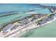 Aerial view of waterfront condos with beach access, docks, and the Intercoastal Waterway at 6030 Boca Grande Cswy # B21, Boca Grande, FL 33921