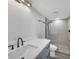 Updated bathroom featuring herringbone tile shower and grey vanity with matte black hardware at 6030 Boca Grande Cswy # B21, Boca Grande, FL 33921
