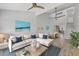 Bright living room featuring an open floor plan, modern decor, and seamless flow to the dining area at 6030 Boca Grande Cswy # B21, Boca Grande, FL 33921