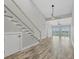 Bright living space with staircase, fan, and expansive windows offering serene water views and an airy feel at 6030 Boca Grande Cswy # B21, Boca Grande, FL 33921