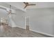 Open living space with adjacent kitchen, staircase, and light wood-look flooring creating a modern feel at 6030 Boca Grande Cswy # B21, Boca Grande, FL 33921