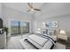 Serene bedroom features a balcony, a large window with bright light, and light, airy decor at 6030 Boca Grande Cswy # B21, Boca Grande, FL 33921