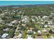 Prime location near the waterfront, aerial view of a residential community with a small pond at 6181 Jack St, Venice, FL 34293