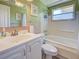 Bathroom with a single sink vanity, toilet, and a bathtub-shower combination at 6181 Jack St, Venice, FL 34293