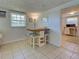 Cozy dining area featuring a table with seating and a view into kitchen at 6181 Jack St, Venice, FL 34293