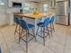 Kitchen island with seating and stainless steel appliances offer ample seating space at 6181 Jack St, Venice, FL 34293