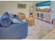 Inviting living room with cozy seating, neutral decor, and entertainment center at 6181 Jack St, Venice, FL 34293