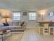 Comfortable living room with sofa, coffee table, and a dining area at 6181 Jack St, Venice, FL 34293
