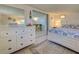 Inviting main bedroom with a dresser, bed, neutral color, and an open doorway to another room at 6181 Jack St, Venice, FL 34293