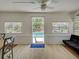 Cozy sunroom with views of the beautiful pool area, furnished with comfortable seating and ample natural light at 6181 Jack St, Venice, FL 34293