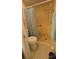 Bathroom featuring a shower with a grab bar and yellow tiled walls at 6540 Coliseum Blvd, Port Charlotte, FL 33981
