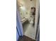 Bathroom featuring black and white flooring and a vanity mirror at 6540 Coliseum Blvd, Port Charlotte, FL 33981