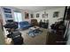 Comfortable bedroom featuring a cozy seating area, natural light, and ample closet space at 6540 Coliseum Blvd, Port Charlotte, FL 33981
