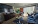 Comfortable bedroom featuring a cozy seating area, natural light, and ample closet space at 6540 Coliseum Blvd, Port Charlotte, FL 33981