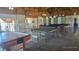 Spacious recreation room featuring ping pong table, pool table, and air hockey at 6540 Coliseum Blvd, Port Charlotte, FL 33981