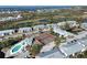 Panoramic aerial view showcasing the community's tennis courts, swimming pool, and proximity to the water at 6800 Placida Rd # 1004, Englewood, FL 34224