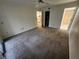Bright bedroom featuring neutral walls, ceiling fan, and doorway to the ensuite bathroom at 6800 Placida Rd # 1004, Englewood, FL 34224