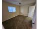 Light bedroom with carpet flooring, a window with blinds, and a closet at 6800 Placida Rd # 1004, Englewood, FL 34224