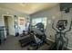 Well-equipped exercise room with treadmill, elliptical machine, and weight training equipment at 6800 Placida Rd # 1004, Englewood, FL 34224