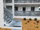Charming condo building featuring gray lattice details, a well-maintained exterior, and inviting landscaping at 6800 Placida Rd # 1004, Englewood, FL 34224