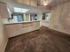 Spacious living room adjacent to the kitchen with ample space for furnishings and an open airy feel at 6800 Placida Rd # 1004, Englewood, FL 34224