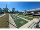 Enjoy outdoor shuffleboard courts with benches and covered seating areas, perfect for community recreation at 6800 Placida Rd # 1004, Englewood, FL 34224
