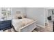 Nicely decorated bedroom with a comfortable bed, stylish dresser, and a shuttered window at 7108 Harle Ave, North Port, FL 34291
