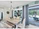 Charming dining area with natural light and seamless access to the outdoor living spaces at 7108 Harle Ave, North Port, FL 34291