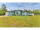 A house with a well-kept lawn and garden at 7108 Harle Ave, North Port, FL 34291