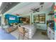 Covered lanai offers seating, an outdoor kitchen and picturesque views of the pool at 7108 Harle Ave, North Port, FL 34291